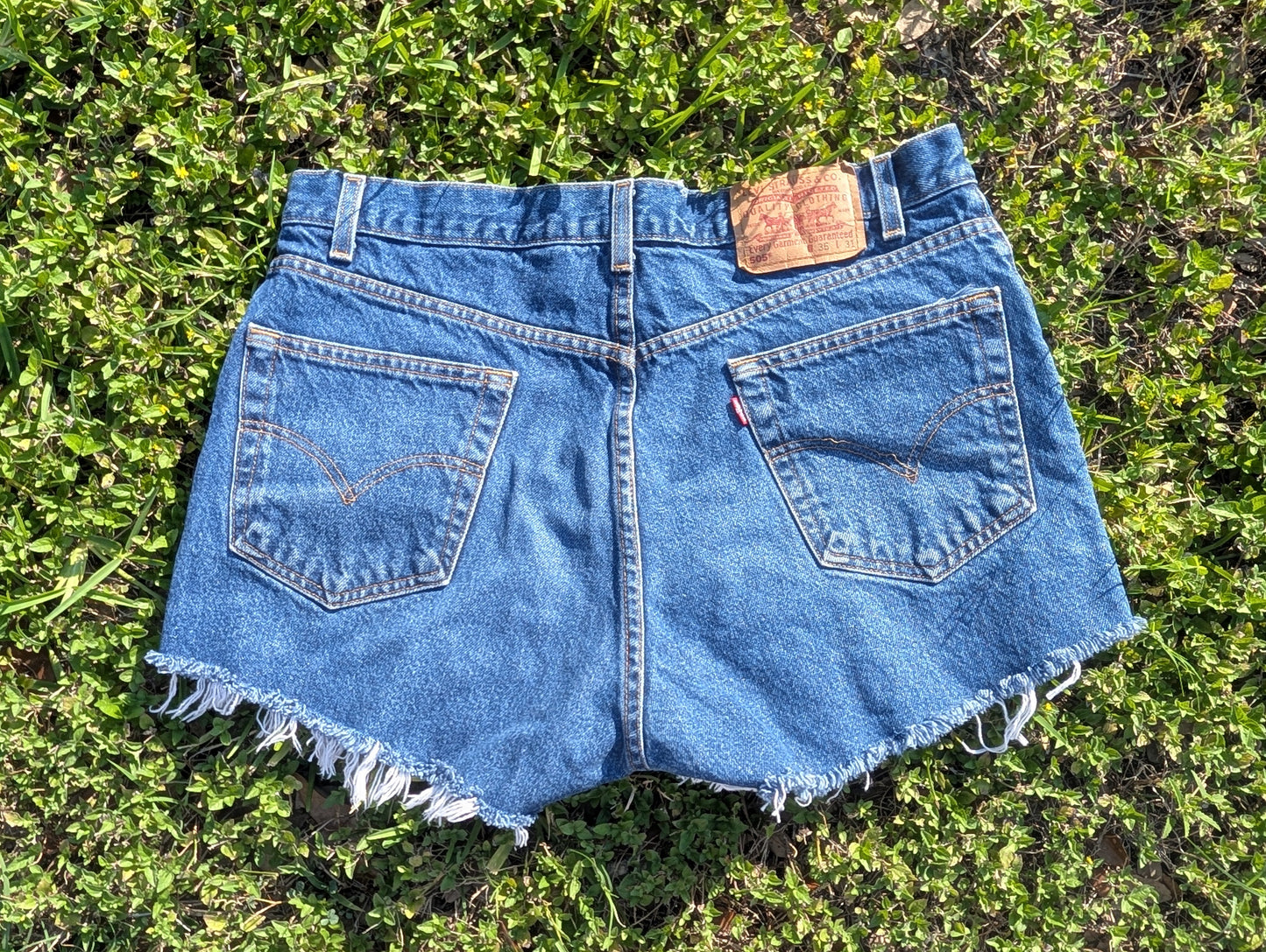 Levi's 505 Distressed Cutoff Denim Shorts with Floral Patch