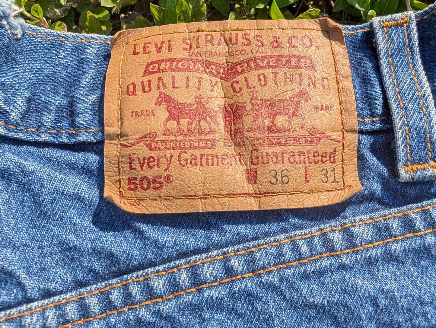 Levi's 505 Distressed Cutoff Denim Shorts with Floral Patch