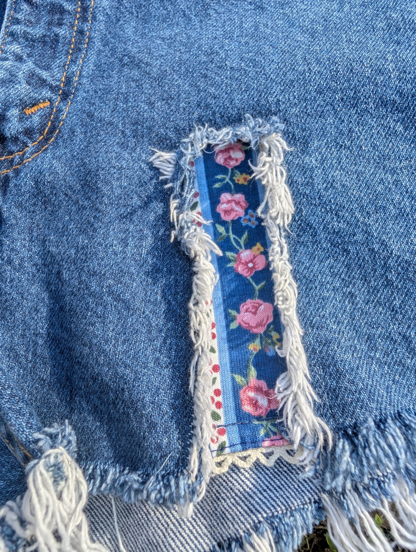 Levi's 505 Distressed Cutoff Denim Shorts with Floral Patch