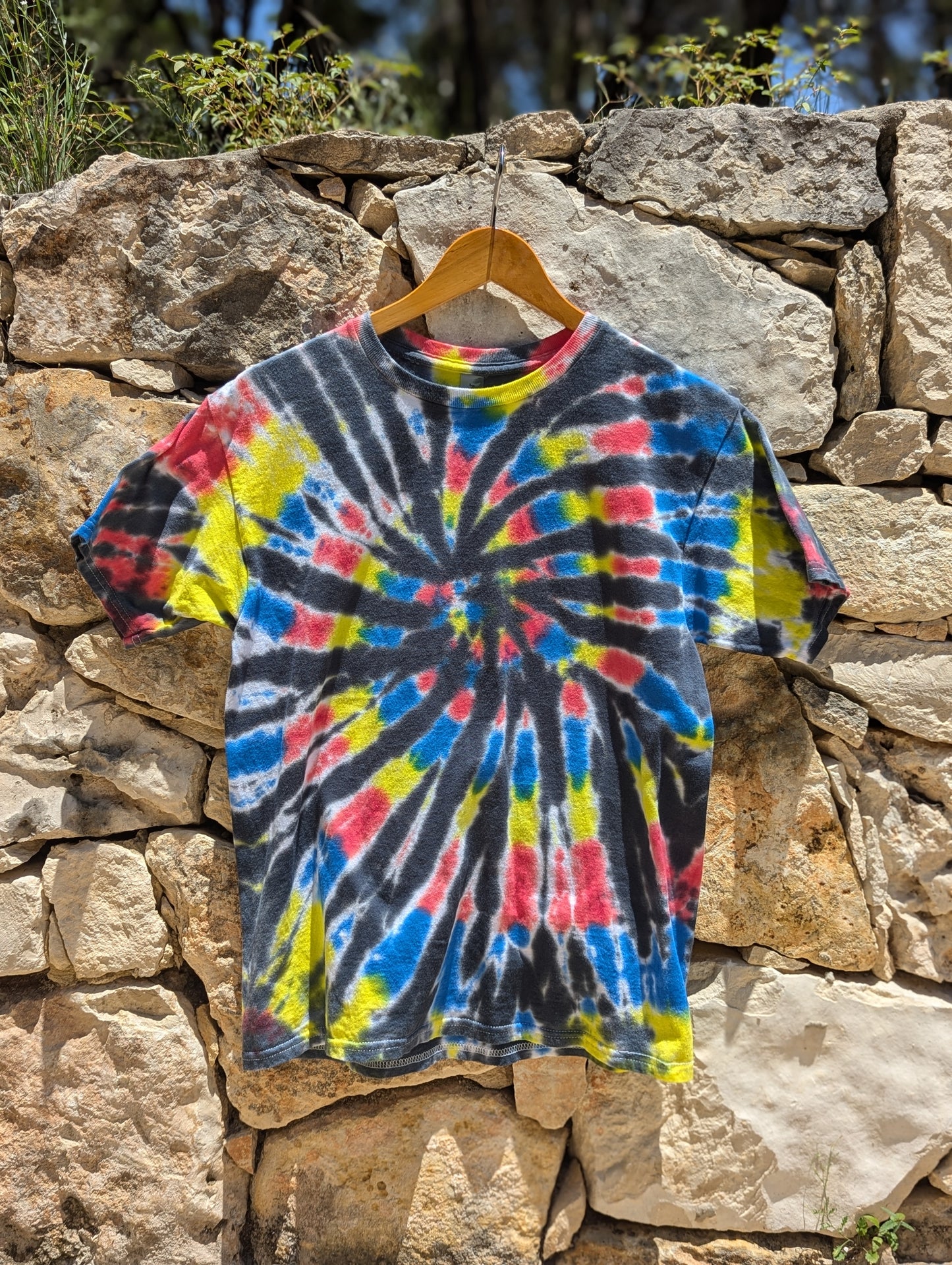 Blue, Red, Yellow, and Black Spiral Tie Dye Shirt - Size YXL.